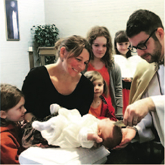 Father Brent A. Bowen, O.P. performs Baptism